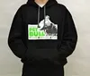 A man wearing a black hoodie with a picture of a dog.