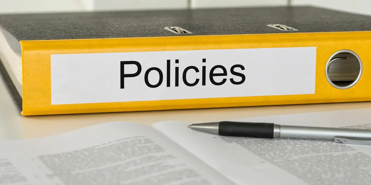 rs=w_1200,h_600,cg_true (1) A book with the word policies on it.