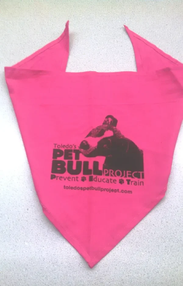 A pink bag with the words " pit bull project " on it.