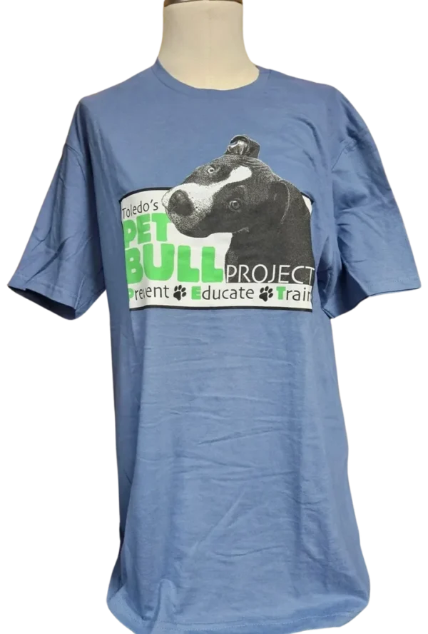A blue t-shirt with a picture of a cow.
